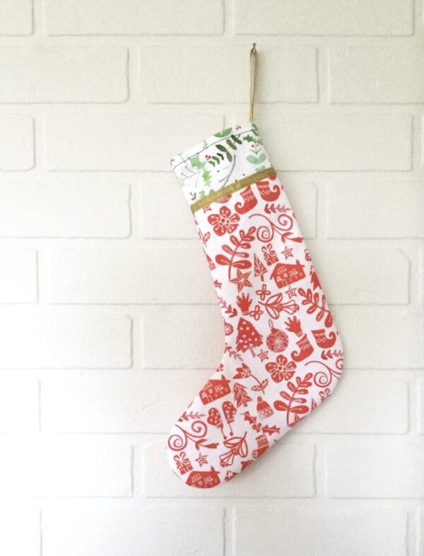 Handmade Scandi Christmas stockings with gold ribbon detailing.