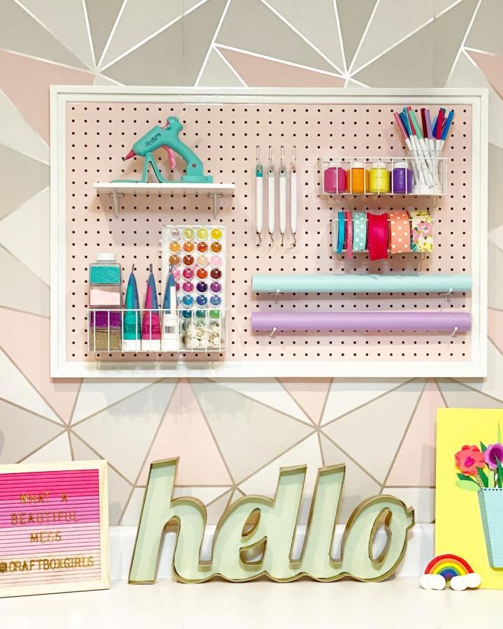 Colorful pegboard organization system from @creativelivingwithlynnlilly perfect for dream craft room inspiration with supplies and tools displayed neatly.