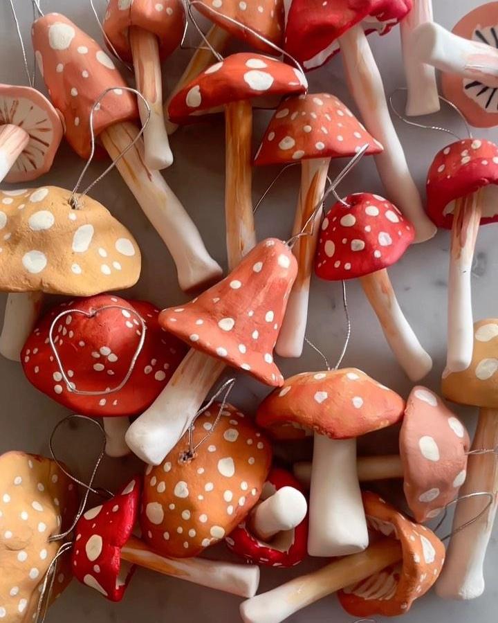 Coral and red fabric mushroom ornaments from @elsielarson with hand-painted white polka dots and wooden stems