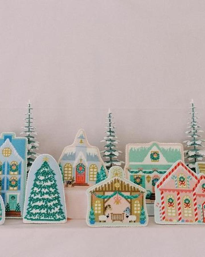 Hand-painted cookie houses from @lepointstudio showcasing diy christmas village ideas with pastel icing and festive details.