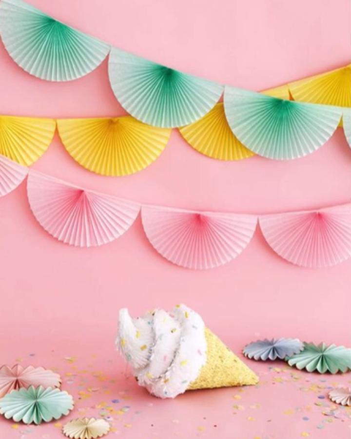 Pleated ombre paper fan bunting from DIY EXPRESS showcasing diy paper garland ideas in mint, yellow, and pink shades