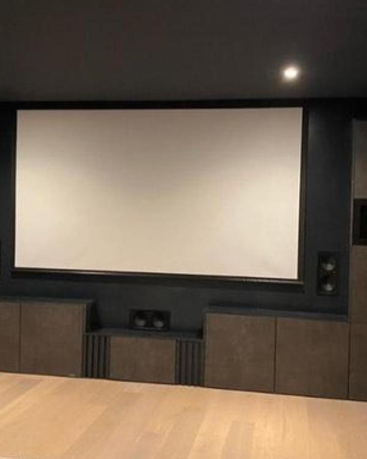 Gray Besta media unit from @miss_decor_cheshire with projector screen and built-in speakers.