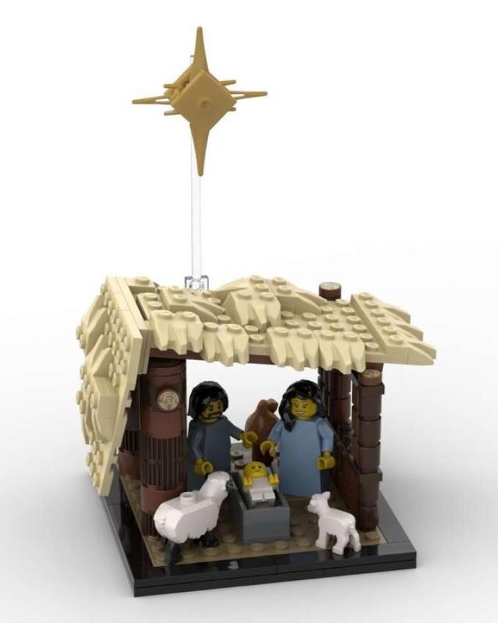 Tan and brown nativity stable from Rebrickable with golden star and minifigures inside.