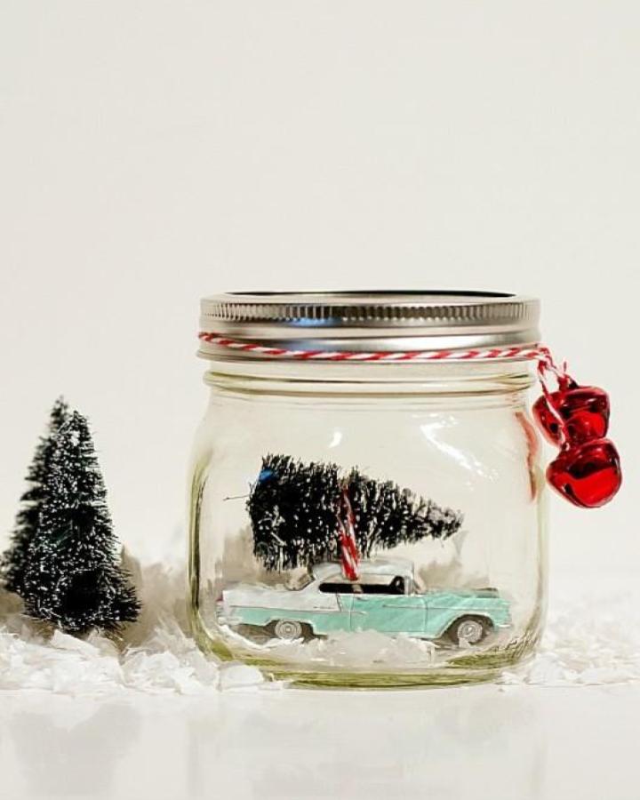 Clear jar with vintage turquoise truck and bottle brush tree from It All Started with Paint featuring festive ribbon