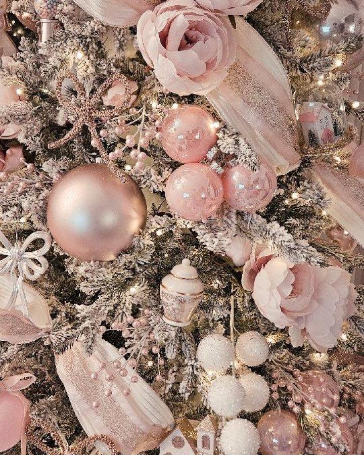 Blush and pearl ornament cluster from @chic.interior.design. Frosted branches with sheer ribbon and fabric flowers.