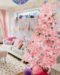 Blush pink christmas tree ideas from @colourpopathome featuring metallic silver ornaments and gold bow accents in pastel rainbow room