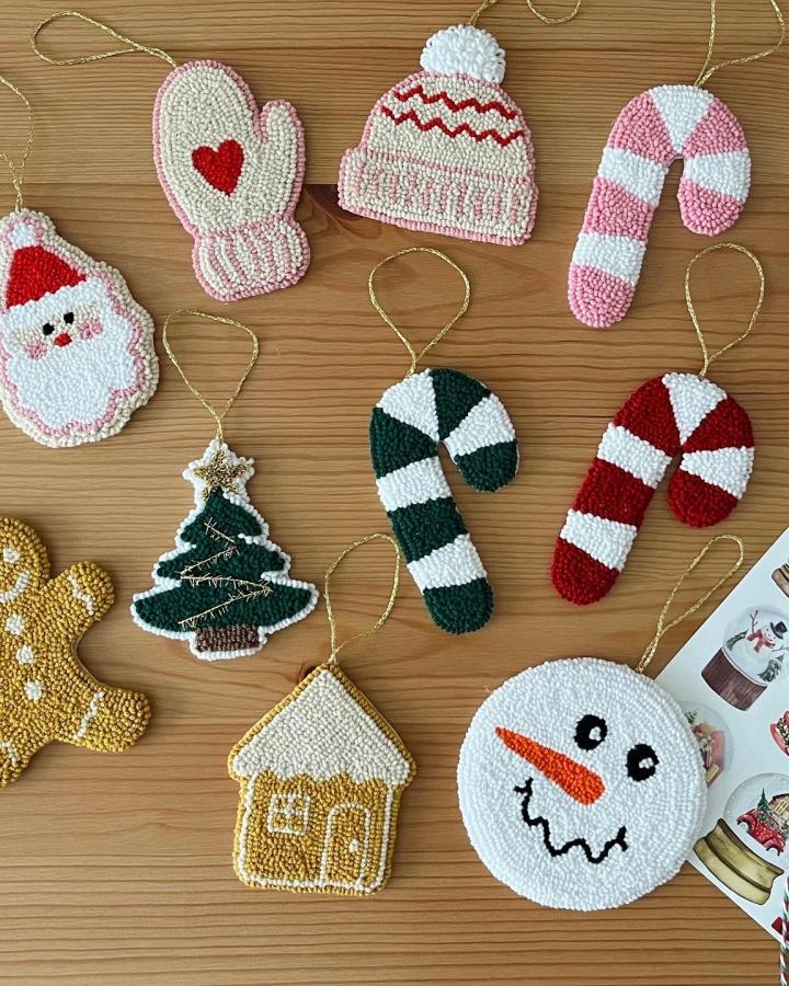 Festive ornament collection from @punchbyemily featuring Santa, candy canes, and winter accessories with textured details.