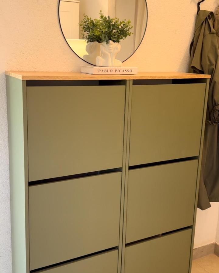olive green matte ikea bissa storage with natural wood top from @marsasmind minimal functional entryway furniture ikea bissa hacks & ideas