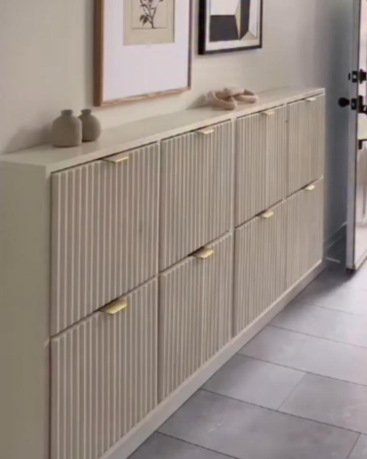 Beige textured ikea bissa hacks & ideas storage cabinet with brass handles in modern hallway from @__katharinamaria.