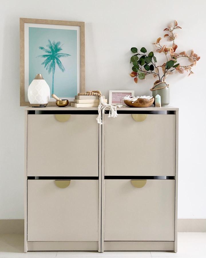 neutral beige Ikea Bissa shoe cabinet from @mynorfolknest with brass handles and natural wood decor showcasing ikea bissa hacks & ideas