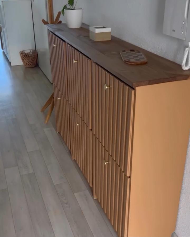 Light wood slat door cabinet with brass handles and wooden top ikea bissa hacks & ideas by @anaparencan.