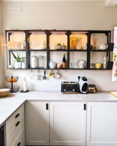 Black and white open shelving kitchen space from @forevermoreat74 with plants, jars, and lighting showcasing ikea enhet ideas.