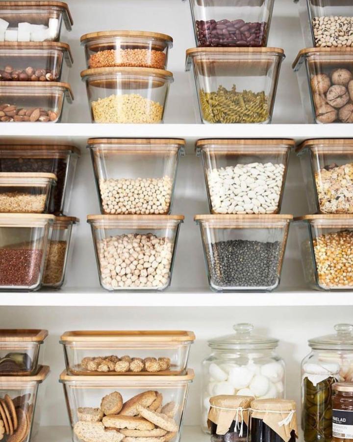 clear glass containers with wood lids pantry shelves from @ikea_australia. Organized stacks for ikea pantry ideas with pasta and beans.