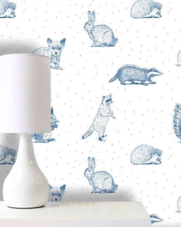 Blue woodland animal wallpaper from BonnieBoldWallpaper on Etsy with charming sketches perfect for peel & stick wallpaper ideas in cozy spaces.