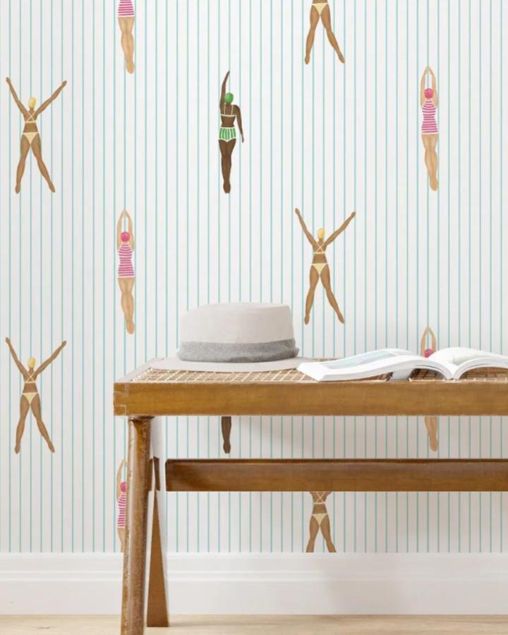 Retro swimmer figures with teal stripes wallpaper from RetroDesignWallpaper with peel & stick wallpaper ideas in a bright, vintage style room.