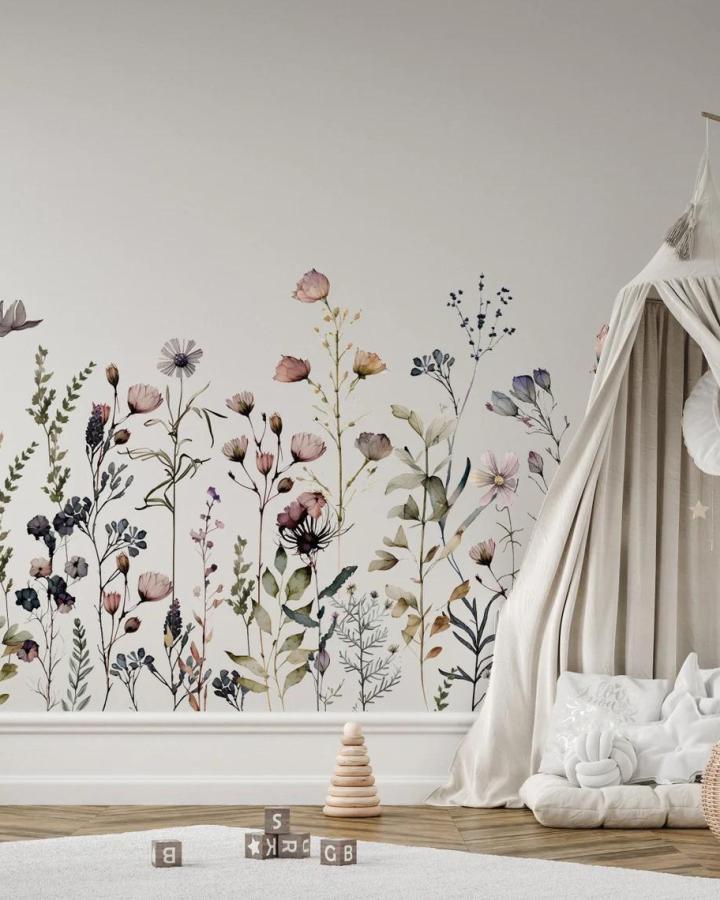 Delicate floral peel & stick wallpaper ideas in a cozy nursery with soft neutral tones and wooden floor accents.