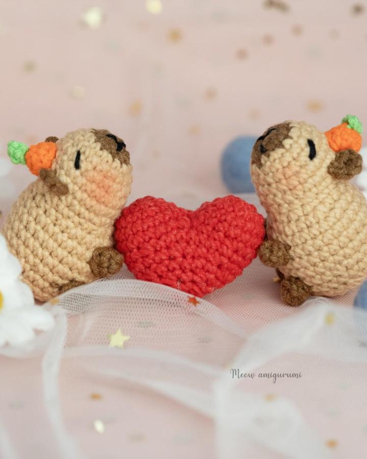 Beige and brown amigurumi pugs with red heart crochet valentines ideas from @meow.amigurumi cute handmade yarn craft display