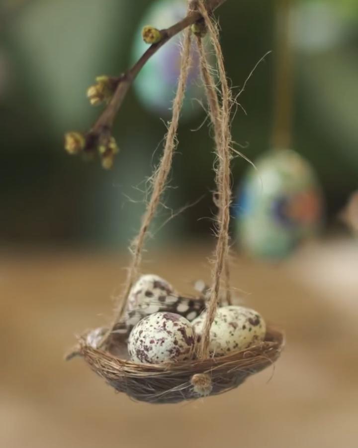 natural twig and jute hanging bird nest with speckled eggs from @sostrenegrene Easter decoration craft