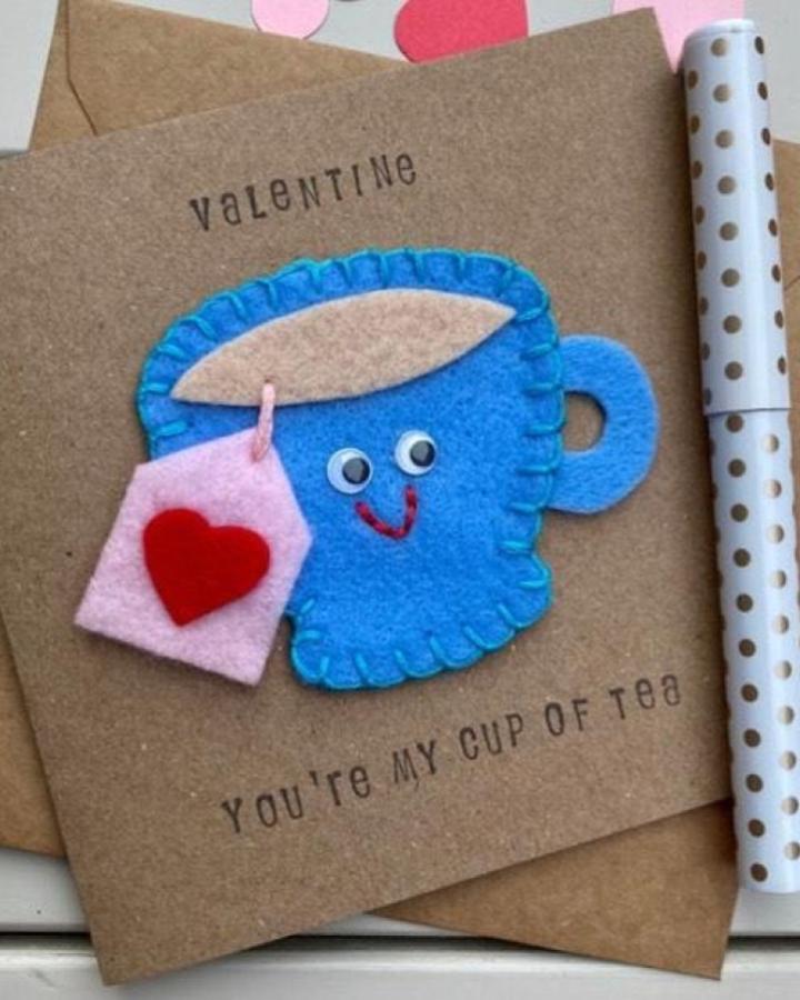 blue felt cup card with pink heart tag and stamped text handmade valentines card ideas from @papersoupcards cozy stitched craft design