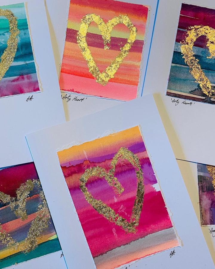 Bright watercolor stripes with glittery gold hearts handmade valentines card ideas from @amieartfulness colorful and textured paper craft