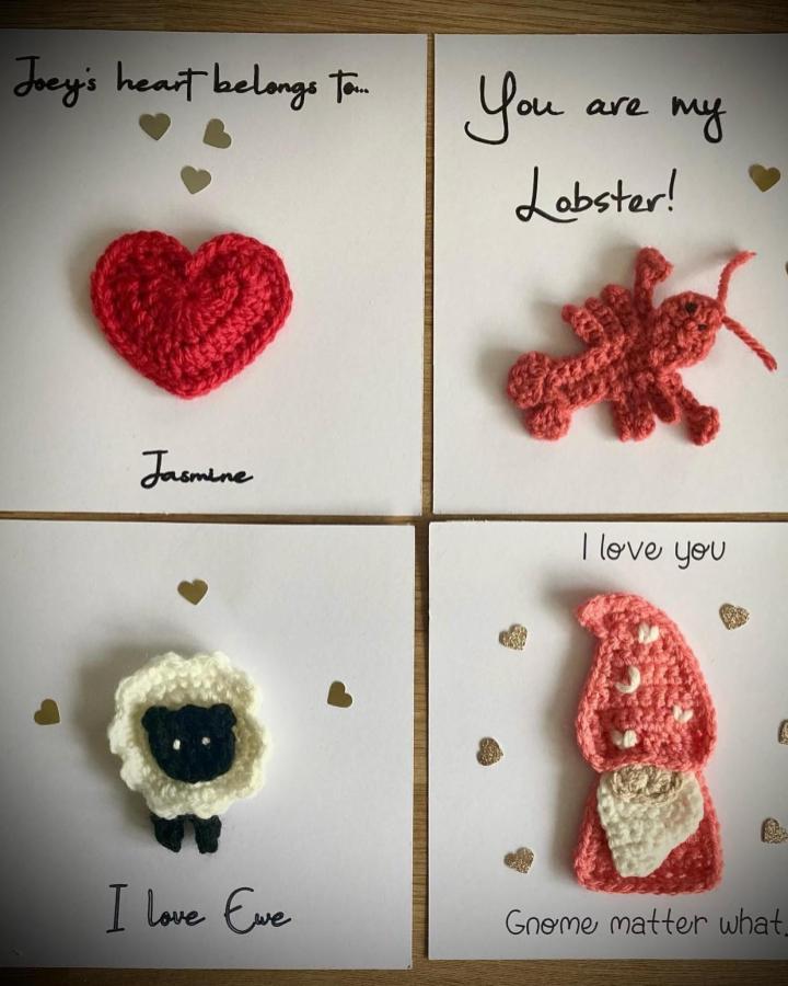 Red and pink crochet shapes on valentines cards by @em_l_walker with handwritten messages and gold heart stickers.