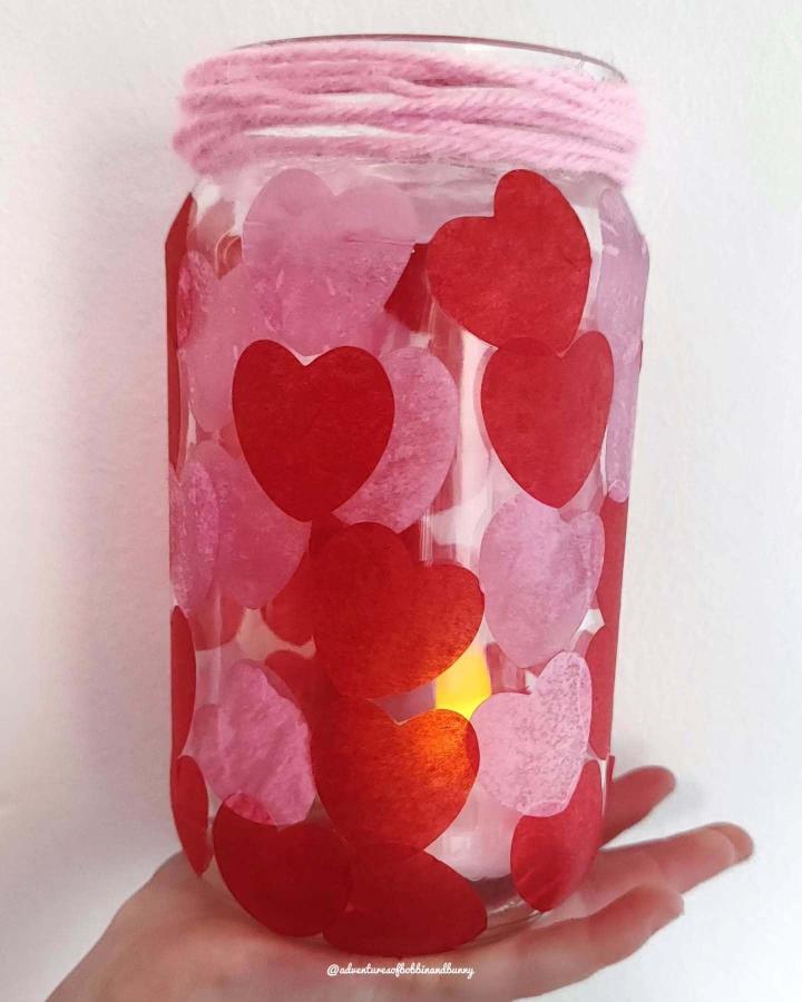 Red and pink tissue paper heart lantern from @adventuresofbobbinandbunny glowing softly valentines crafts for kids.