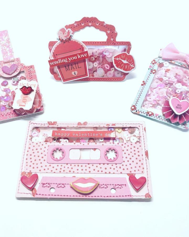 Pink and red shaker Valentine-themed paper crafts with lips and hearts from @little_pink_crafter, featuring sequins and playful designs.