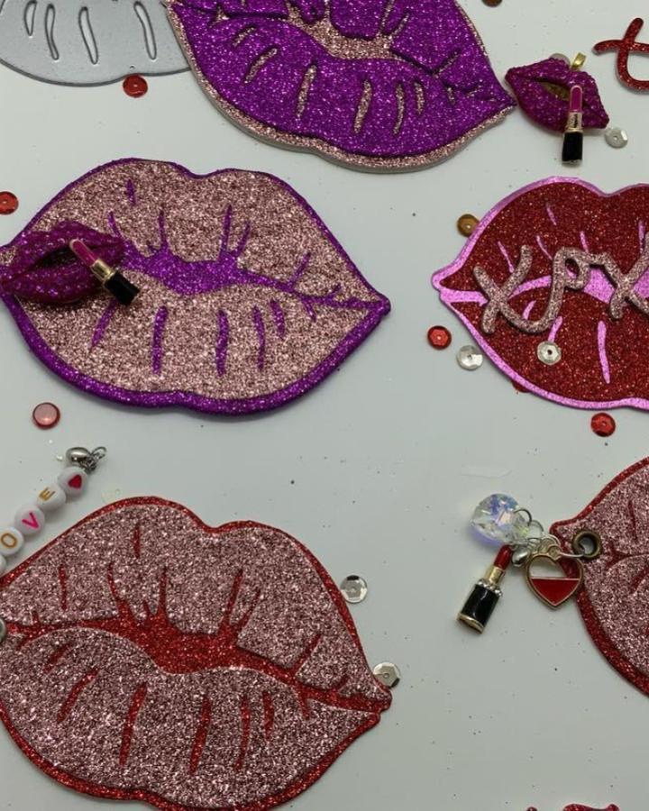 Glittery lip-shaped Valentines paper craft ideas from @inkspirations.de with tiny lipstick charms and sequins for added sparkle.