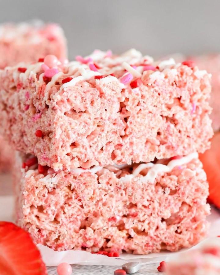 pink marshmallow Rice Krispies treats stacked with heart sprinkles from @dancearoundthekitchen2019 for valentines treat ideas