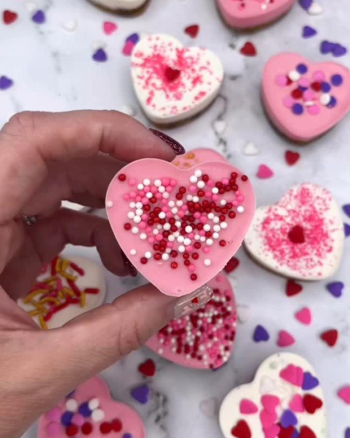 pink heart-shaped sprinkle-covered treat from @cakedbyrach valentines treat ideas colorful and charming handcrafted sweets