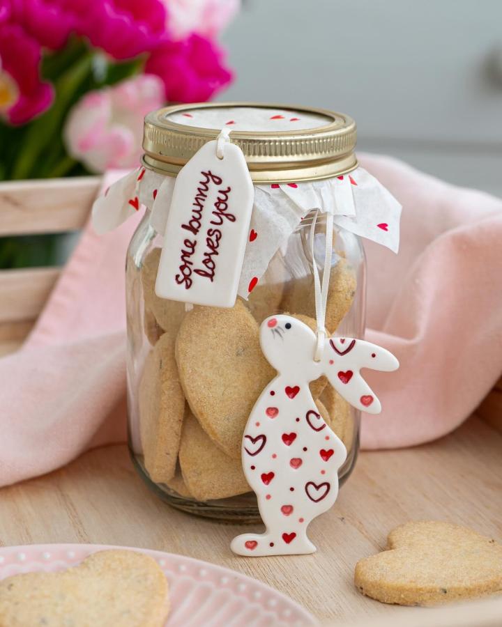 white ceramic bunny and heart cookie jar from @theceramicbutton with valentines treat ideas and red heart accents