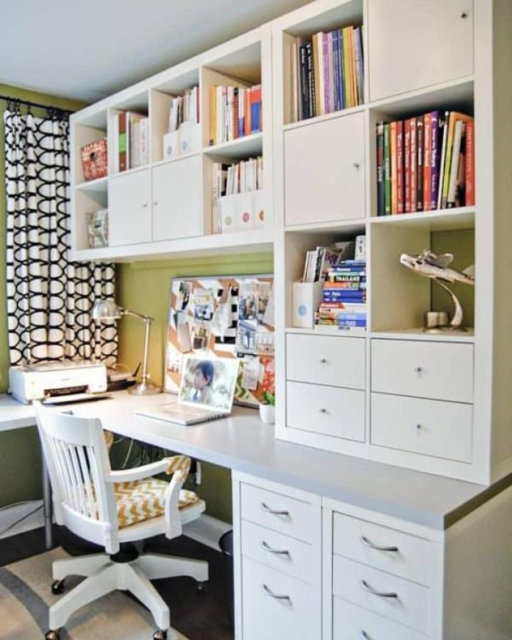 White organized home office with ikea kallax desk hacks & ideas from Rambling Renovators. Clean shelving, drawers, and closed cabinets create functional workspace.