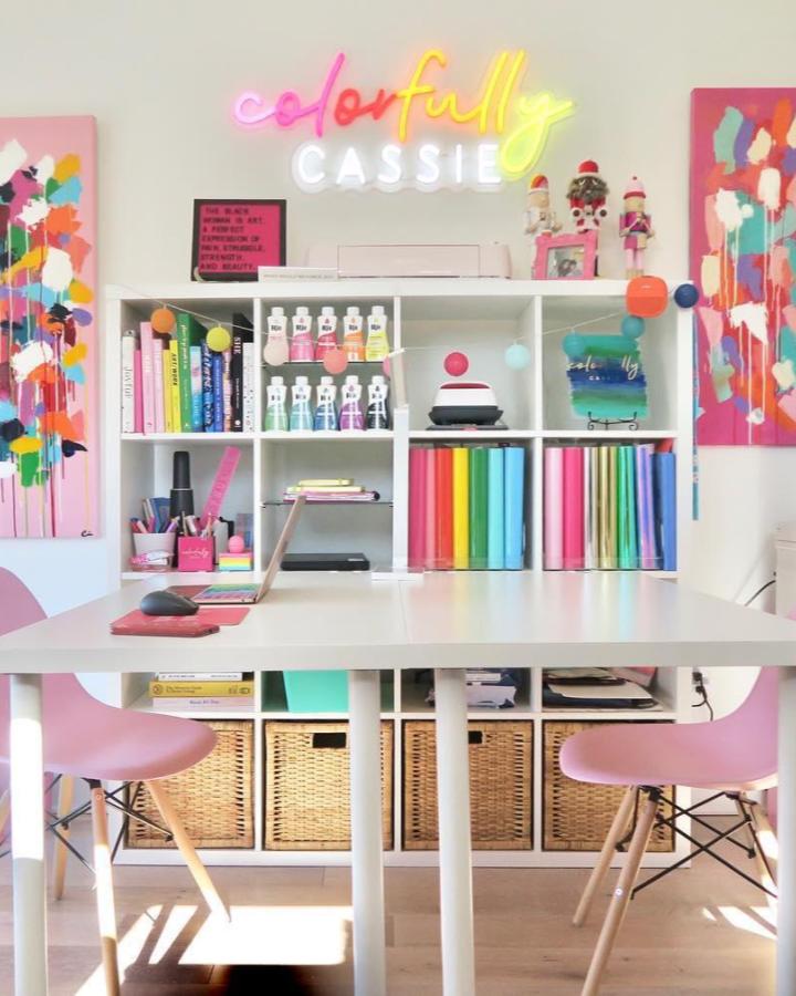 White Ikea Kallax desk with colorful craft materials and wicker baskets from @colorfullycassie Bright, organized ikea kallax desk hacks & ideas workspace.
