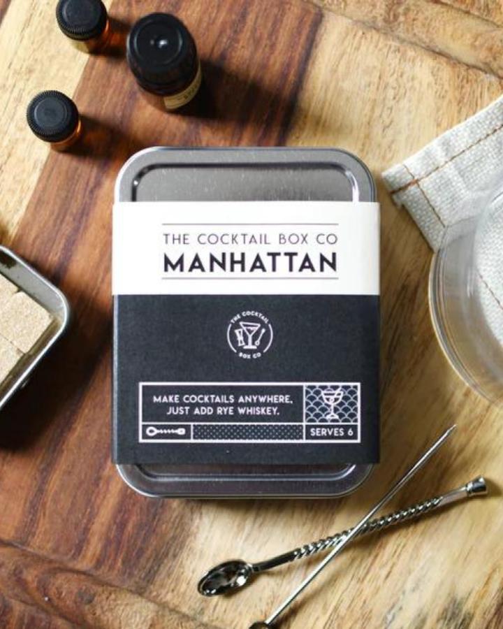 Metal cocktail kit with tiny bottles and stirring spoons from Lego. Valentines gift ideas for him with classic Manhattan cocktail theme.