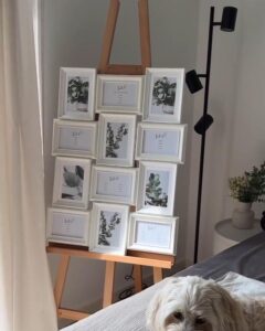 white textured Ikea Knoppang frame seating chart display from @larissiia__. Rustic modern wedding seating plan with greenery accents ikea wedding hacks & ideas