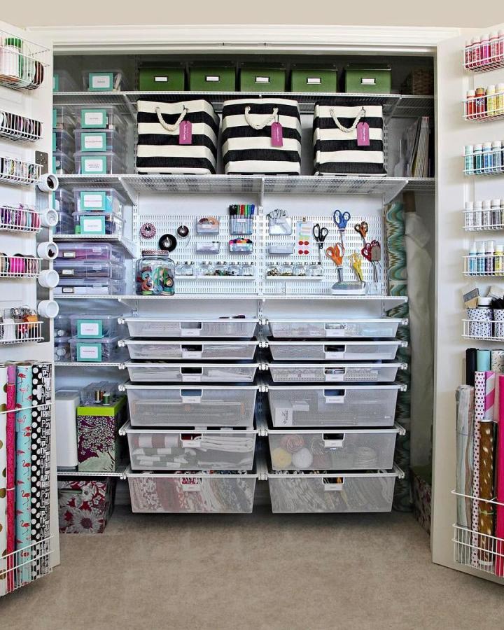 white and black striped craft closet from @cassiesugarplum. Clear drawers and wire shelves keep supplies tidy.