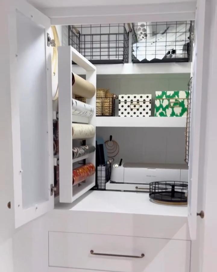 white and black closet craft storage from @farmhouseish. pull-out shelves, patterned boxes, and a sewing machine create tidy craft closet ideas.