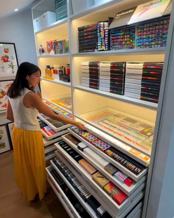 Warm white lit drawers craft closet from @a.aradilla. Colorful markers and paper stay neatly organized.