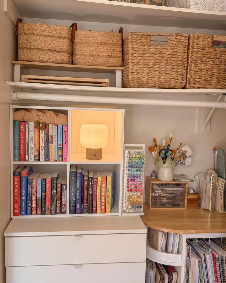 Natural woven baskets and white shelving craft closet ideas from @cozy.games. Cozy, organized, and softly lit.