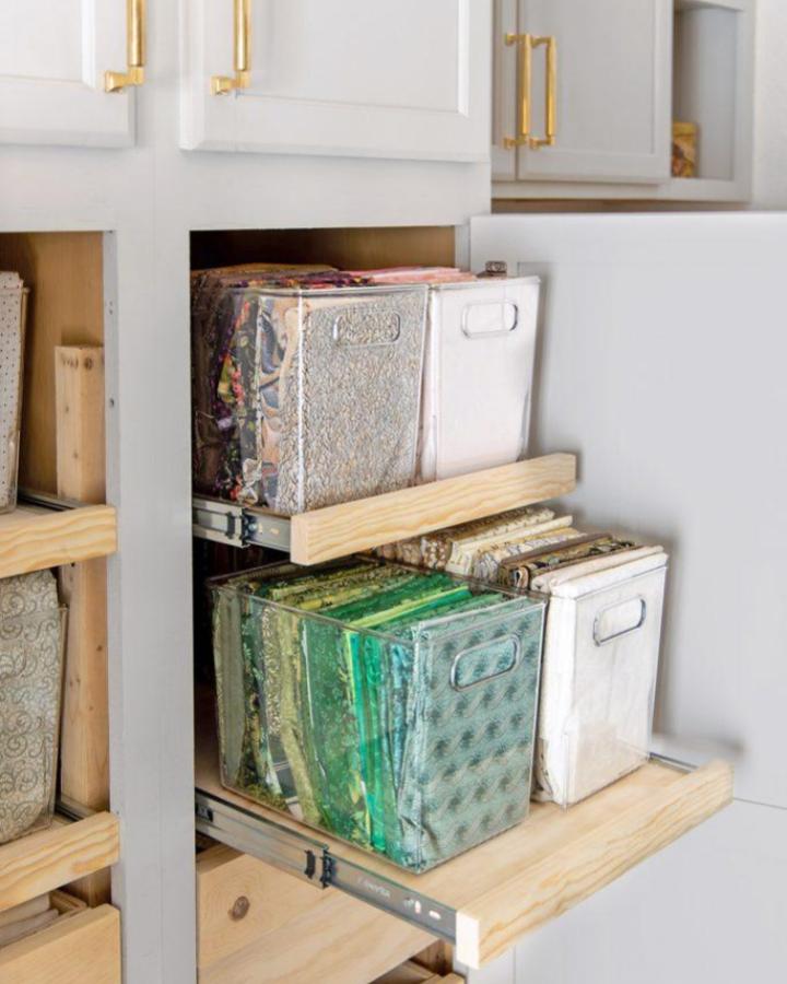 clear plastic and wood craft storage from Homemade by Carmona. Pull out shelves keep fabric bins easy to reach.