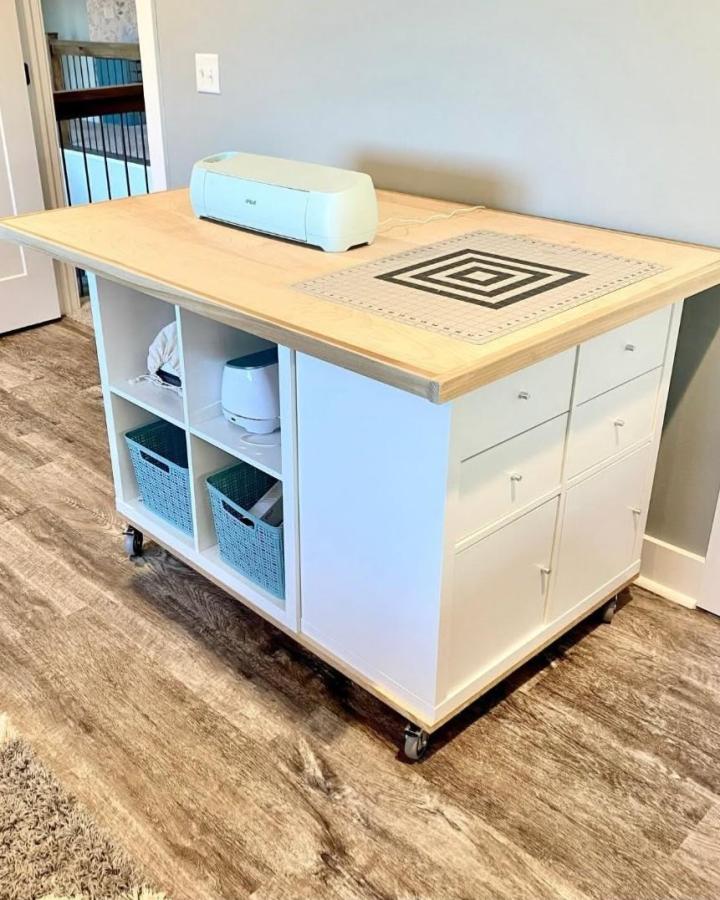 light wood and white Kallax craft bench from @robertsbarndolife. Tidy cubbies and drawers for craft room organization ideas.