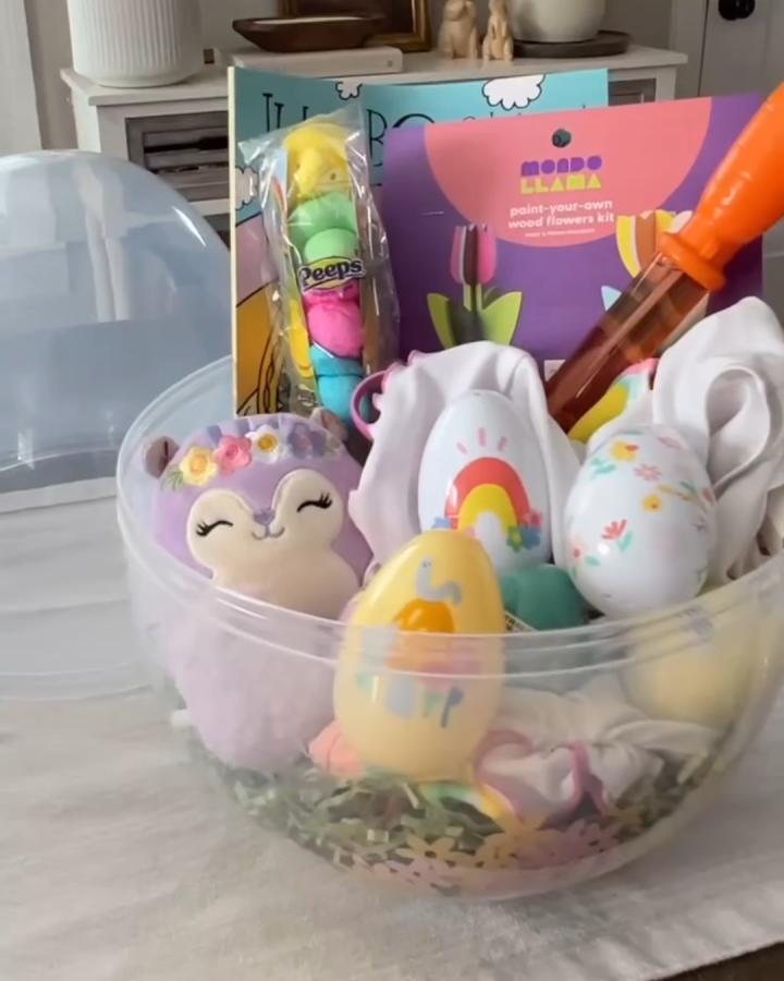 clear plastic craft-inspired Easter basket from @momminwithmeg filled with colorful decorated eggs and creative kits