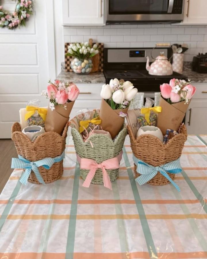 Woven rustic Easter basket ideas with pastel gingham ribbons and tulip bouquets by @cherish.larsen on kitchen table.
