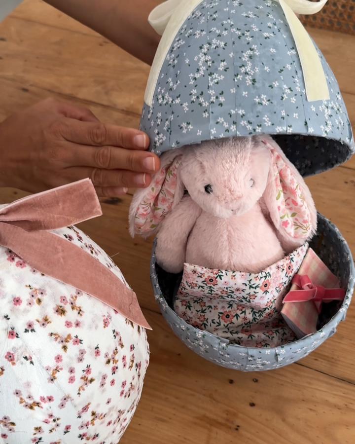 Blue floral fabric Easter egg with plush bunny and small gift from @genevavanderzeil showing unique easter basket ideas.