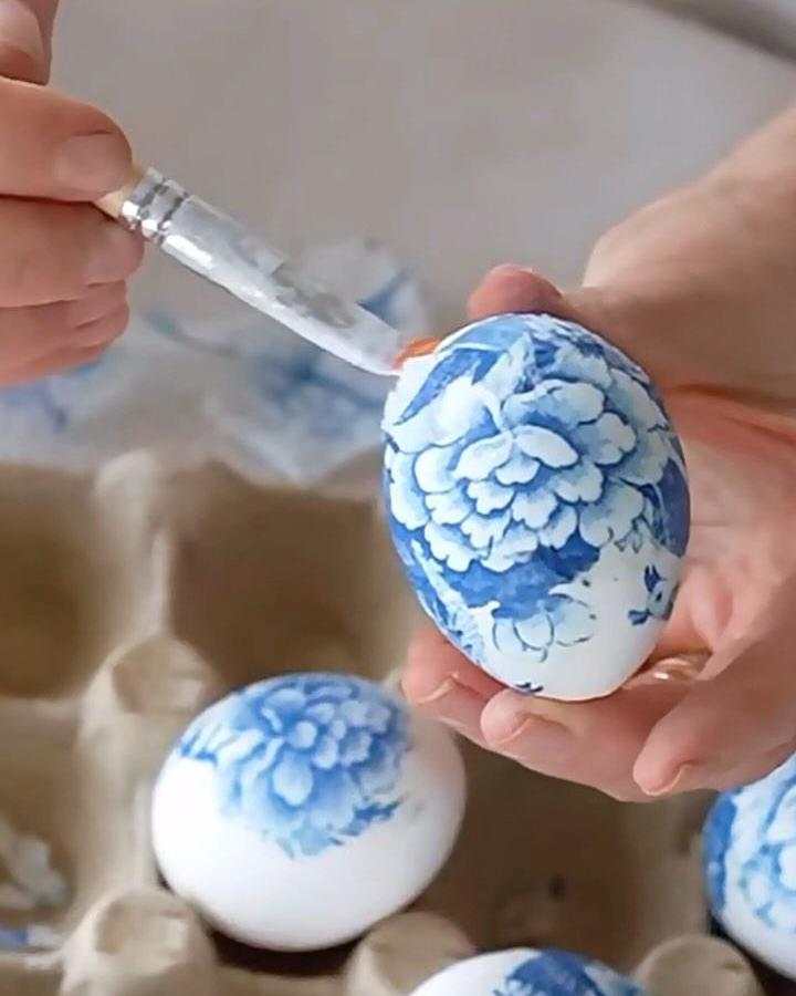 Blue floral decoupage Easter eggs held in hands from @mynewenglandhome. Elegant craft with vintage-inspired design for adults.