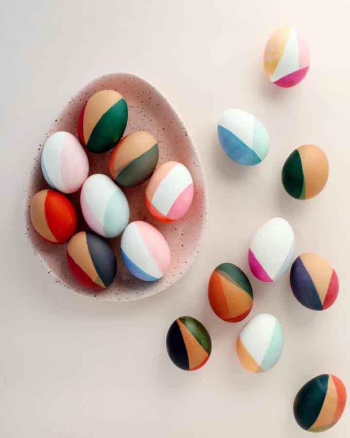 Color blocked pastel and earthy tone painted eggs from Oh So Beautiful Paper modern and artistic easter egg decorating ideas for adults.