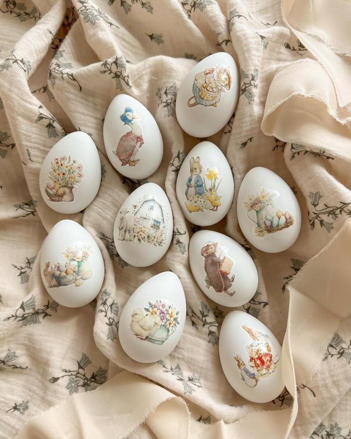 Soft pastel vintage decoupage Easter eggs from @heyitsshoko. Delicate storybook illustrations on smooth eggshells for easter egg decorating ideas for adults.