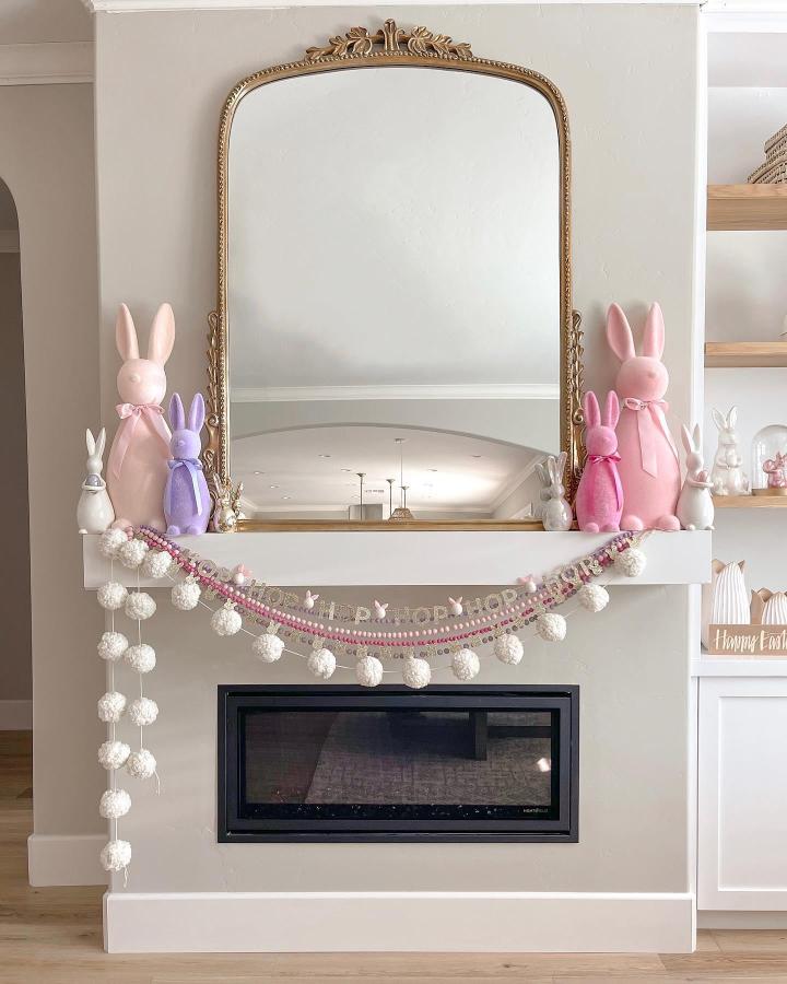 White pom pom and pastel bead mantel garland from @aurelie.erikson. Soft, festive easter garland ideas with bunny accents.