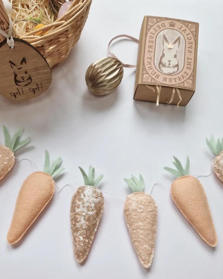 peach sequined carrot felt garland from @_bysadie_ soft handmade spring decoration for easter garland ideas