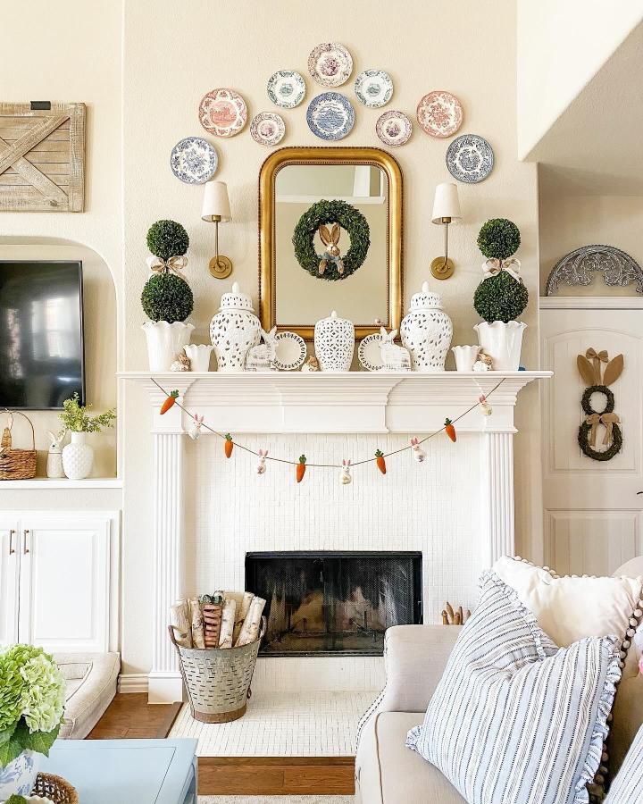 white ceramic and greenery Easter mantel decor ideas from @houseonhideaway with bunny wreath and felt carrot garland